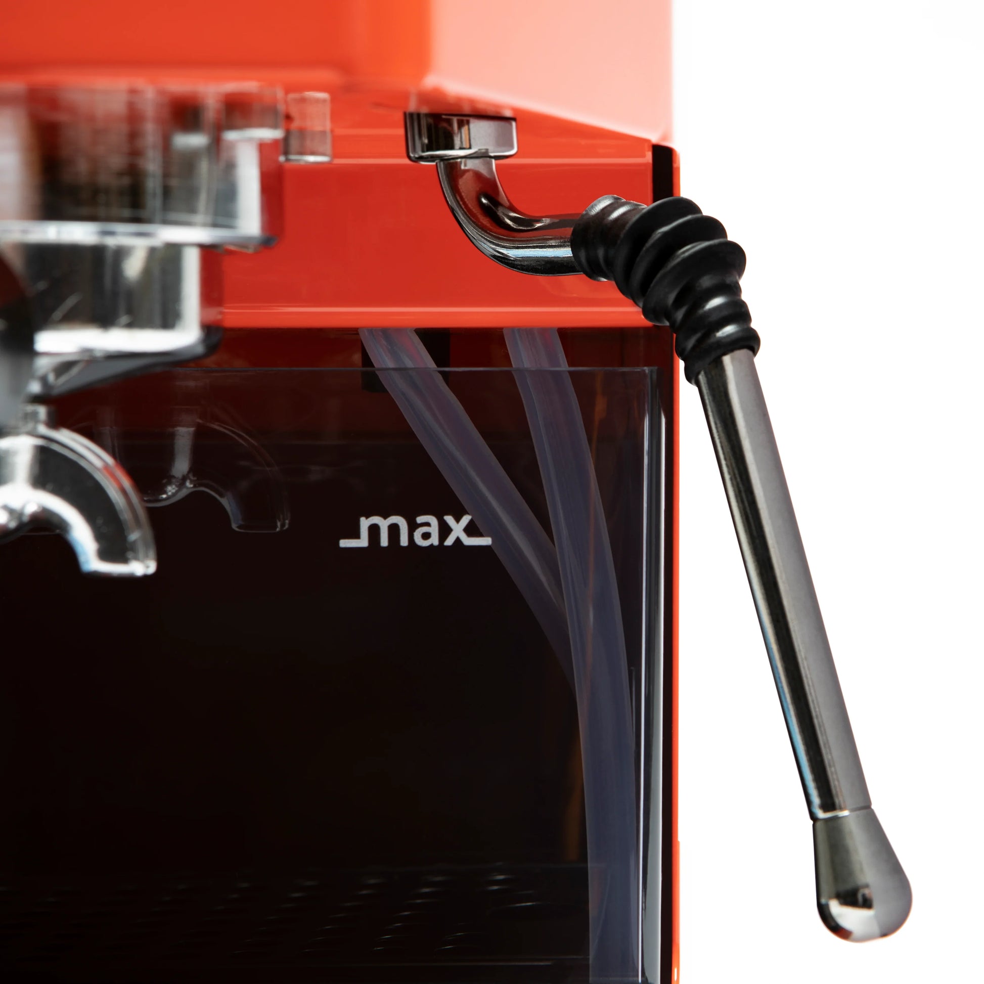 Close-up of a red espresso machine with a black steam wand and silver metal components, featuring the word "max" on the front.

